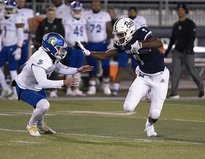 Nevada’s Romeo Doubs faces off against a San Jose State defender during the 2021 season.