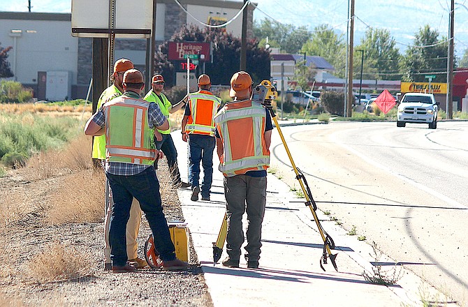 A Nevada Department of Transportation survey crew works along Highway 395 in southern Gardnerville last week.