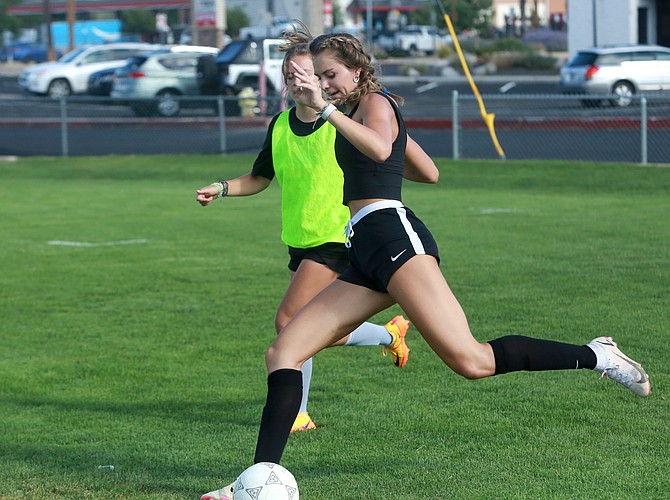 Douglas High junior Ava Coons turns to cross the ball into the box, during a Tiger practice last week.