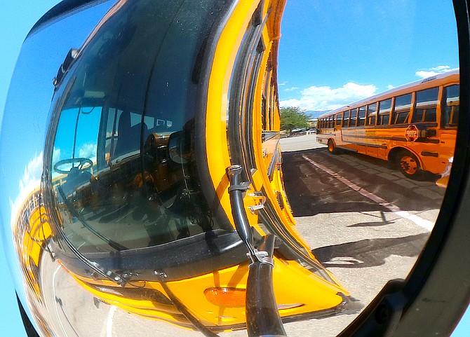 Douglas County school buses reflect on the coming school year as they are prepared to roll out on Monday.