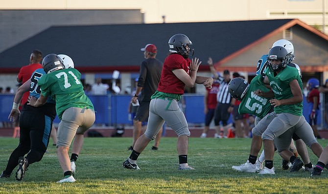 Fallon junior quarterback Bryce Adams receives good protection from the offensive line in a scrimmage against North Valleys earlier this month.