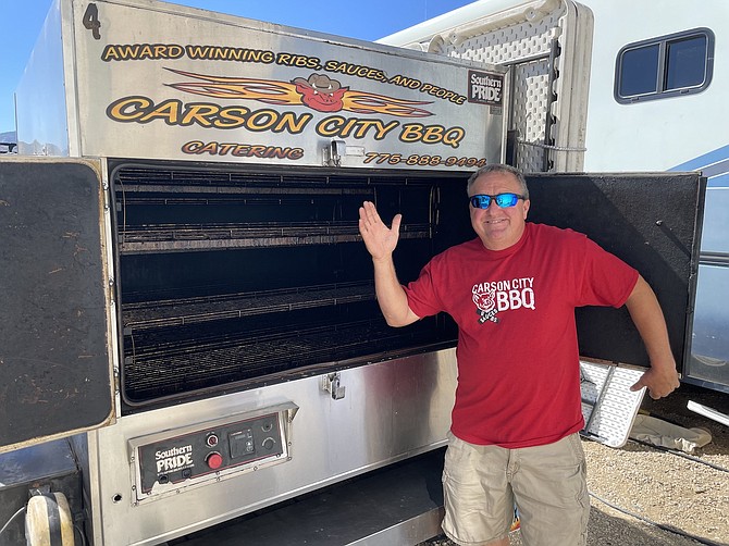 Phil Hyatt, owner of Carson City BBQ, showing off one of his smokers on Aug. 22, 2022.