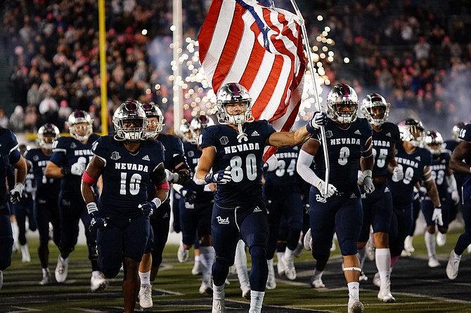The Nevada football team enters Mackay Stadium on Oct. 9, 2021 to face New Mexico State.