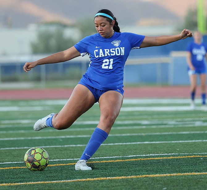 Monse Iza fires a goal in the 15th minute in Carson High girls' soccer's 1-1 draw against Reno Tuesday night.