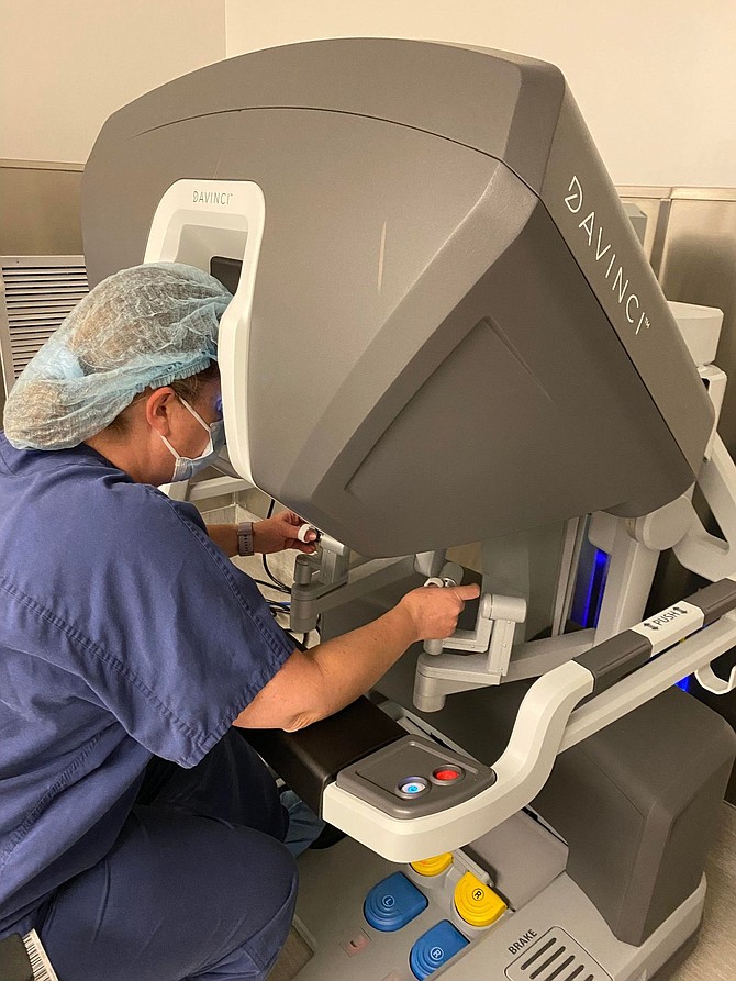 A member of the Carson Valley Medical Center surgical team guides the da Vinci robotics controls during a surgery simulation.