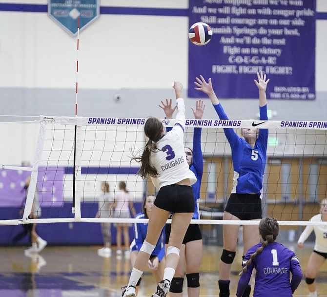 Anna Turner (5) goes up for a block against Spanish Springs on Tuesday in Sparks. Turner led Carson with nine kills and three blocks in the loss to the Cougars.