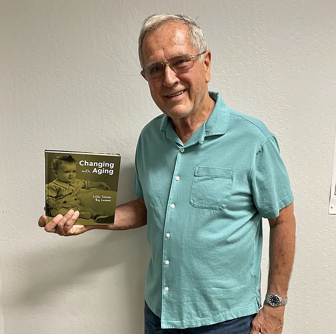 Don Kuhl with his book on Sept. 2.