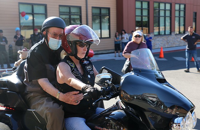 Rolland ‘Ron’ Carter takes a ride Sept. 2, 2022 for his 100th birthday with Battle Born Harley-Davidson road captain Kim Walter.