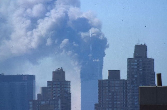 The burning towers of the World Trade Center as seen from uptown.