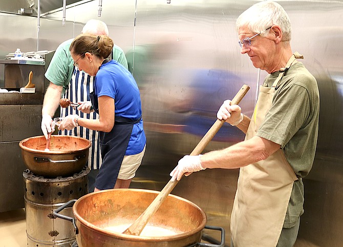 Candymakers stir the pot in the Genoa Town Kitchen on Aug. 26.