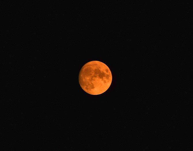 Smoke from the Mosquito Fire turned the sun and the moon red on Thursday night.