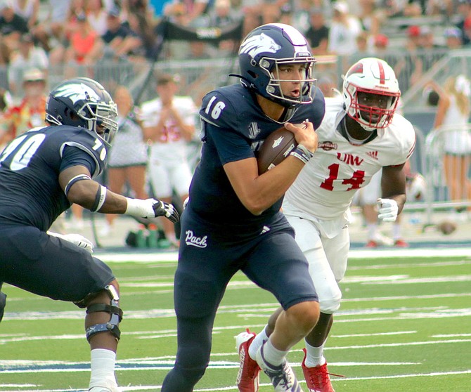 Wolf Pack quarterback Nate Cox takes off on a run in the first half against Incarnate Word on Sept. 10, 2022 in Reno.