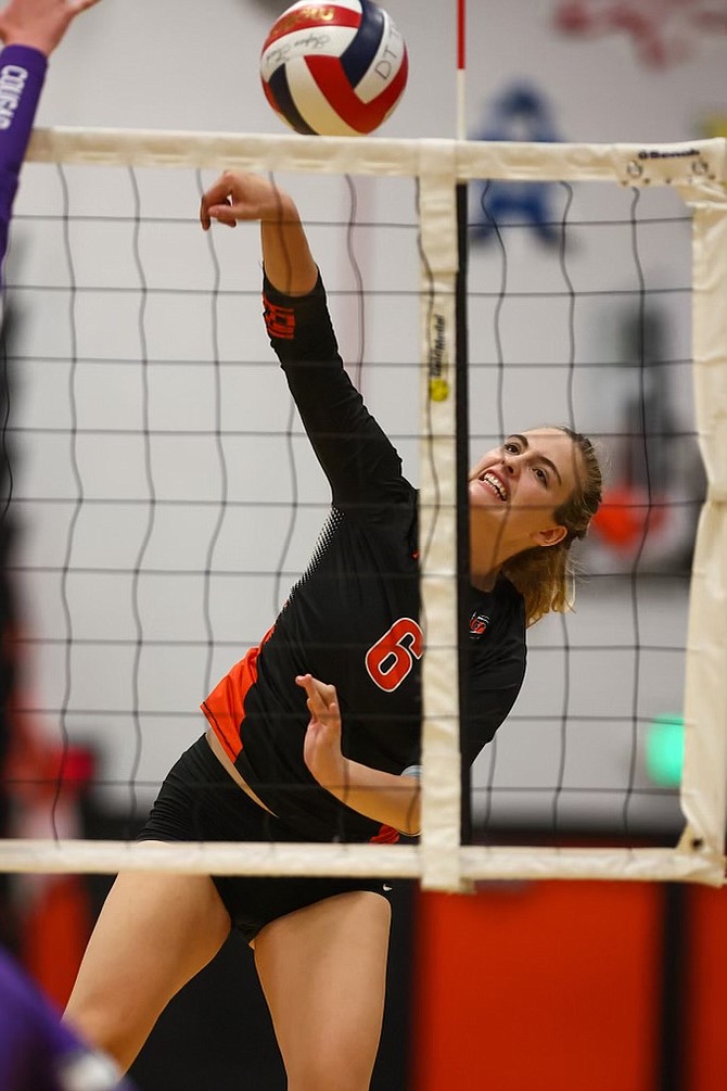 Douglas High's Shasta Garr (6) goes up for a kill Thursday evening during a match against Spanish Springs. Garr had eight kills in the Tigers' five-set loss to the Cougars.