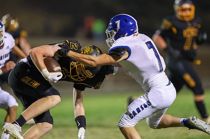Carson’s Kincaid Gill tackles Galena’s Colson Kermode during Friday’s game.