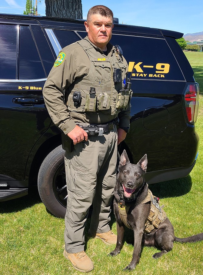 Carson City Sheriff’s Deputy Jeff Pullen with his K-9 partner, Blue, in June 2022.