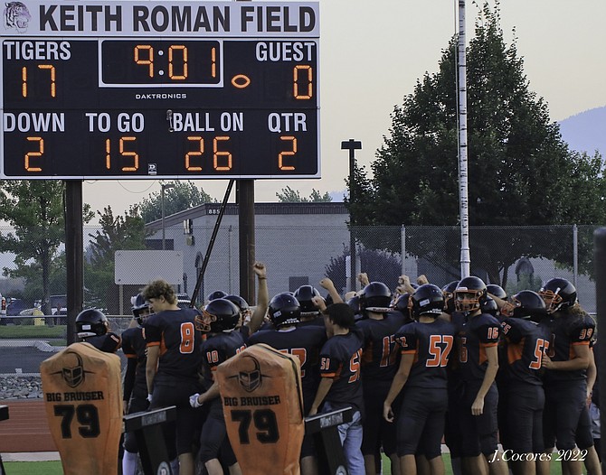 Douglas Tigers JV Football team celebrate their win over Galena after the game was called due to smoke on Thursday. Photo special to The R-C by John Cocores.