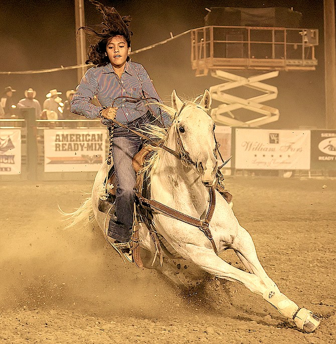 A barrel racer turns a corner at last weekend's Douglas County Rodeo. Photo special to The R-C by JT Humphrey