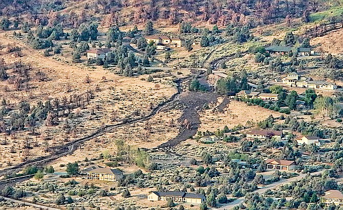 A photo from the top of a mountain shows the Holbrook Highlands drainage leading down to Highway 395 on Thursday.