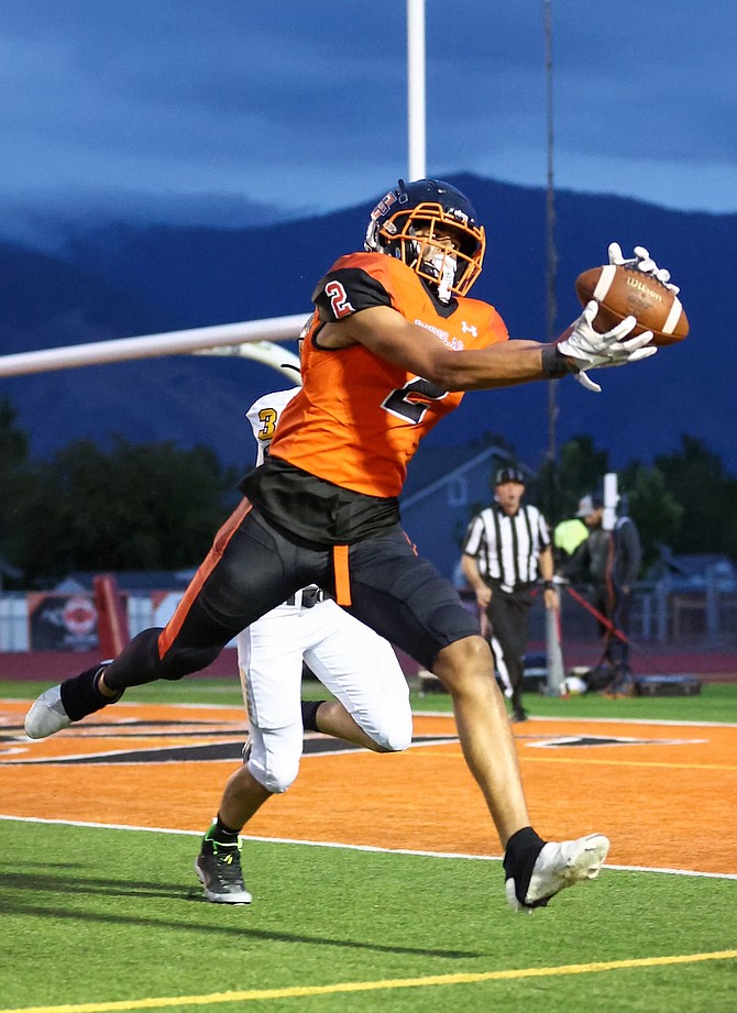 Douglas' Trace Estes hauls in a 14-yard scoring pass with 39 seconds left in the Tigers' game Monday against Galena.