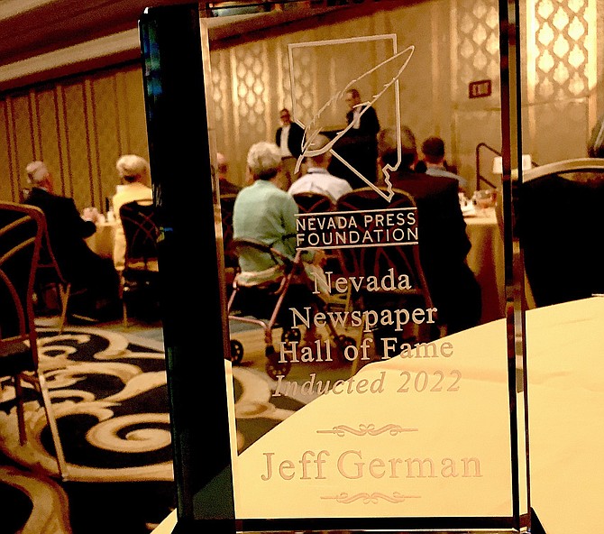 Speakers are visible through Jeff German's Nevada Hall of Fame award.