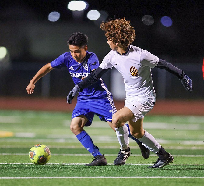 Carson’s Miguel Vargas works against a Galena defender on Wednesday.