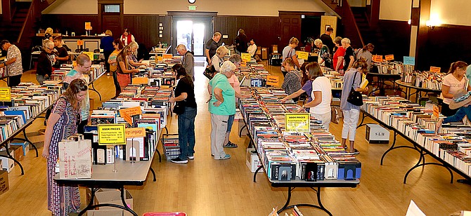 Book fans peruse the stacks at the Friends of the Douglas County Public Library Used Book Sale on Sept. 17. The sale raised $6,200 and will return in May.