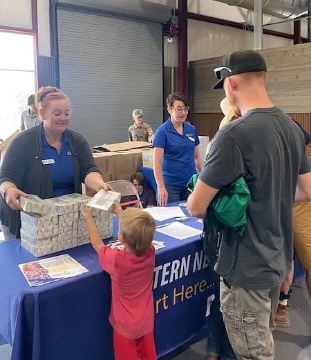 Desirae Blunt Lamkey, left, and WNC Fallon Campus Director Jessica Rowe meet community members during Fallon Community Day earlier this summer.