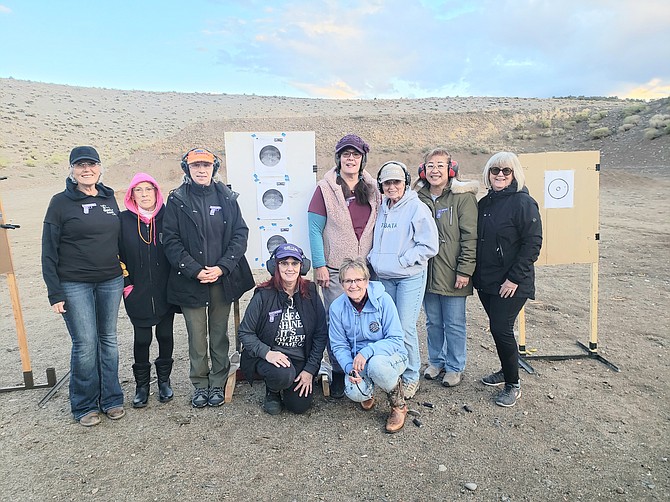 Members of Nevada’s only listed chapter of A Girl and A Gun gather to celebrate Tammy Uva’s certification as a facilitator. Special to The R-C