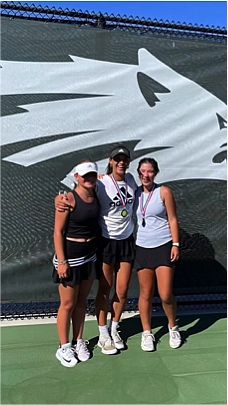 Grand Prix Champion Joscelyn Turner (center), with the second and third place finishers.