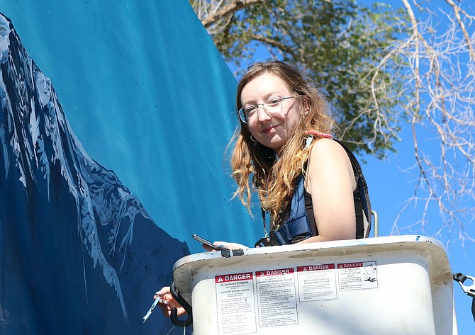 Cheyenne Renee Marcus takes a break from working on the Gardnerville Station mural.