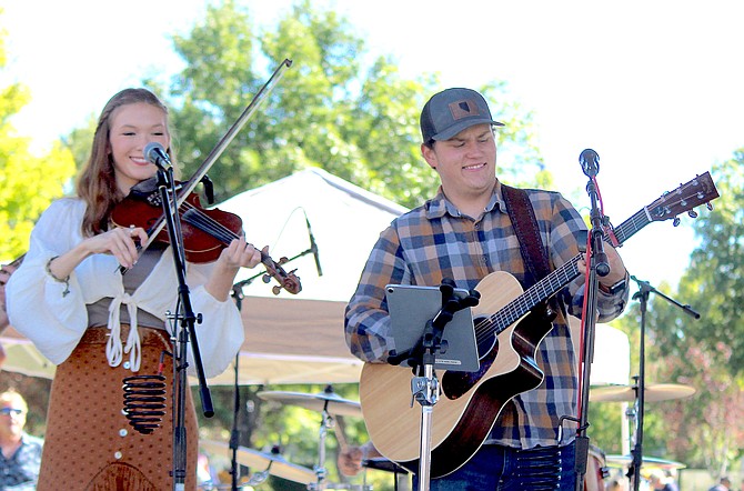 Fiddler Rhianna Carter performs with Gardnerville resident Jakota Wass on Saturday at Heritage Park.