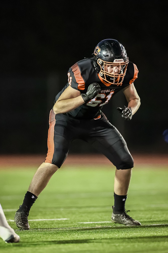 Douglas High lineman Jack Ross looks for a block Friday evening against Damonte Ranch.