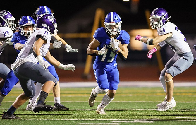 Carson High running back Marcus Montes hits a hole against Spanish Springs last week. The Senators will have their hands full Thursday against the top team in the North, Bishop Manogue.