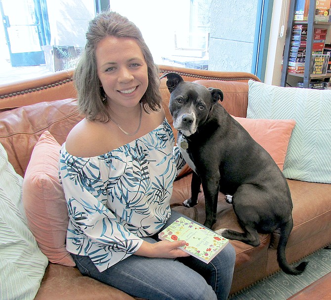 Luminary Books owner Bethany Frediani and Sirius Black hang out at the bookstore Sept. 17.