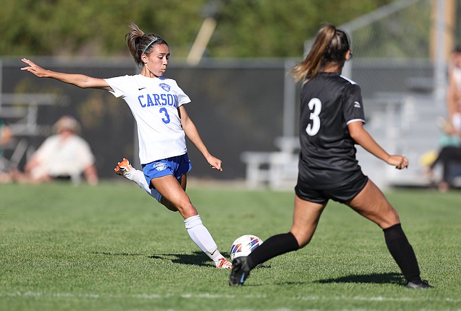 Carson High’s Addy Morgan winds up to shoot Tuesday against Douglas High. Morgan tallied a goal and an assist in the Senators’ 4-0 win over the Tigers.