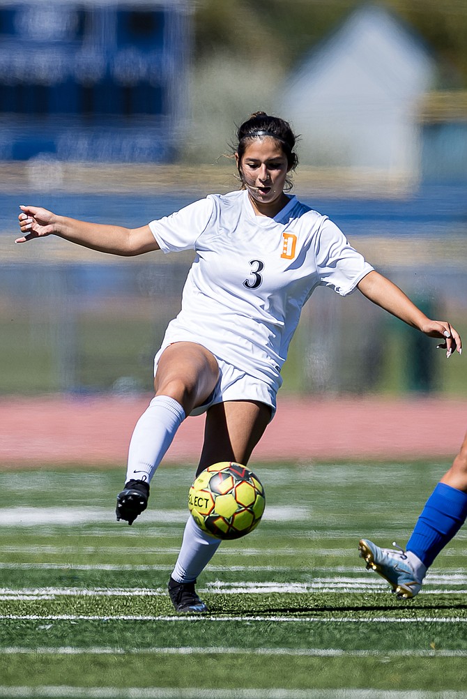 Douglas High’s Johanna Ruelas knocks a ball down to her feet during a contest earlier this season. Ruelas scored her first goal of the season in a 7-0 win over Spanish Springs.