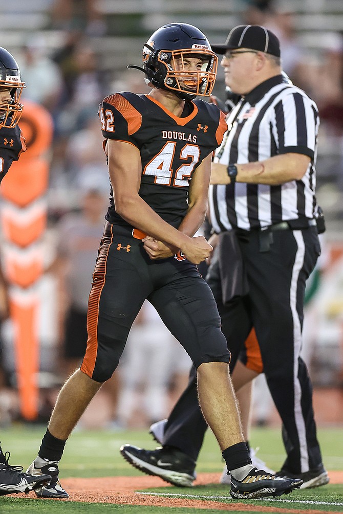 Cole Smalley (42) shows his excitement after a play during Douglas High football’s season opener against Argonaut. Smalley leads the state of Nevada in total tackles through six games.