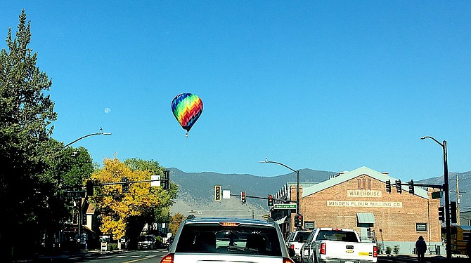 Kathy Happle took this photo of a hot air balloon soaring over traffic on Highway 395 in Minden on Wednesday morning.