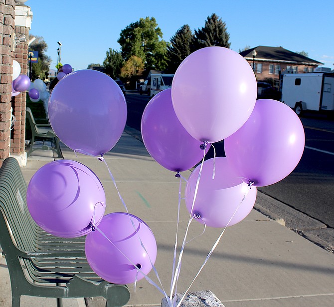 Balloons float in front of the Carson Valley Museum & Cultural Center that were later released as part of the candlelight vigil conducted by the Family Support Council.