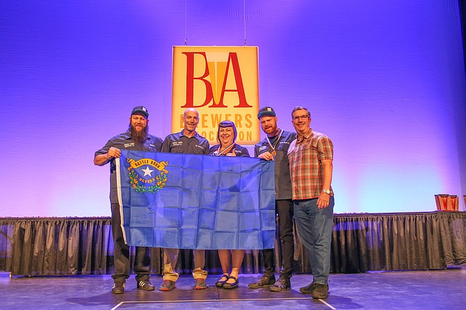 From left, Ryan Bauer, Jeff Young, Jessica Young and Robert Fink. Eric Coffman was not able to attend to the awards ceremony, STBC excepted on his behalf.