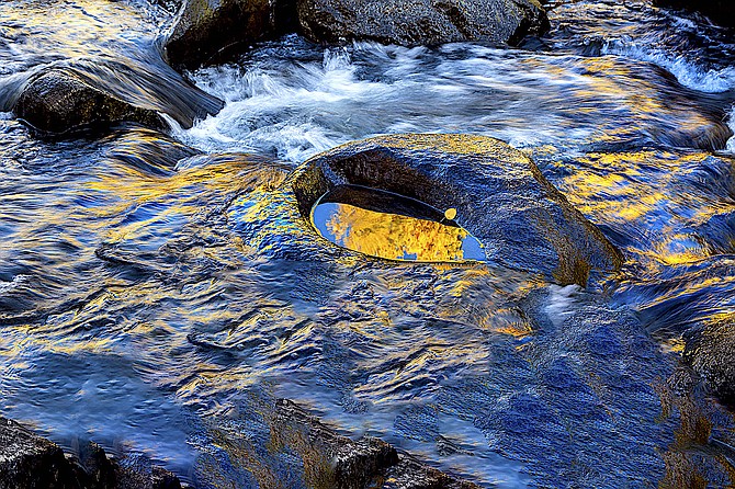 Golden leaves are reflected in a still pool on the West Fork of the Carson River in Alpine County in this photo by Minden photographer Jay Aldrich.