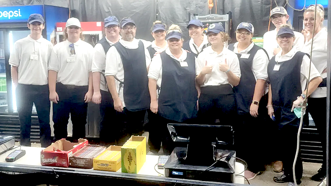 Working the Wolf Pack concession stand are, from left, Hunter Adams, Ryder McNabb, Angela Viera, Eric Grimes, Heidi Hockenberry-Grimes, Rochelle Tisdale, Melissa Mackedon, Ruby Hiskett, Jackie Bogdanowicz, Talon Johnson, Page Hiskett, and Amber Morrow.