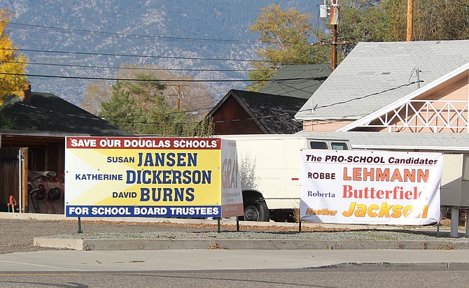 Campaign signs for both slates seeking Douglas County School Board are prominently displayed in downtown Gardnerville.