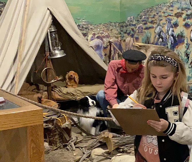 A student takes notes at the Basque display at the Carson Valley Museum & Cultural Center. Photo special to The R-C by Robin Sarantos