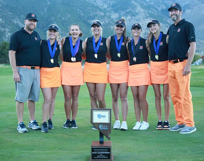 The Douglas High girls golf team poses for a photo after winning the Class 3A state title at Genoa Lakes Golf Course on Tuesday. Pictured, left to right, are head coach JD Frisby, Madison Frisby, Abbigail Detsch, Mackenzie Willis, Logan Karwoski, Abby Miller, Giana Zinke and coach Markus Zinke.