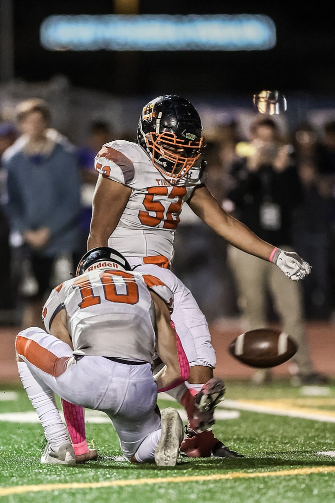 Douglas High kicker Kaleb Valdez (52) boots home a field goal against Carson High on Friday. Valdez has yet to miss a kick for the Tigers this season, going a perfect 10-for-10 on extra points and 4-for-4 on field goals.