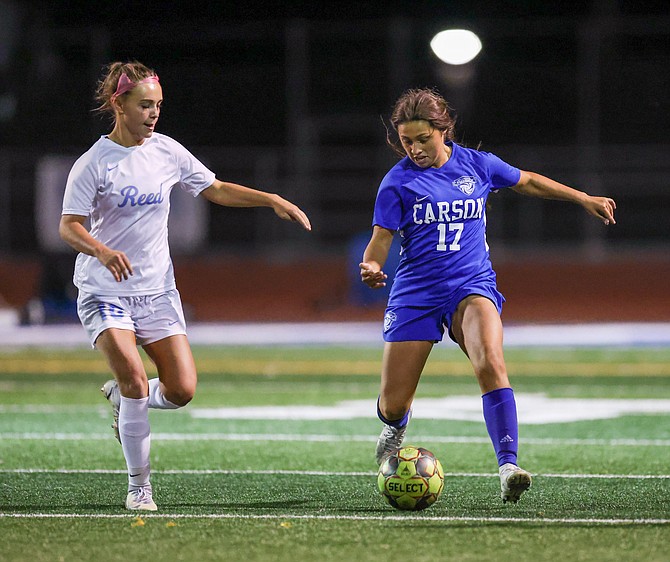 Elayna Quintero (17) dribbles past a Reed player during their contest Tuesday evening. Carson bested Reed, 2-1, to pick up its 10th win of the season.