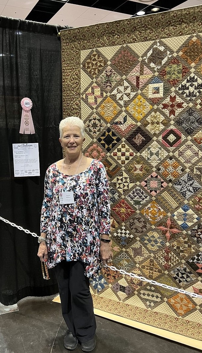 Sarah Jo McKee and her award-winning quilt.