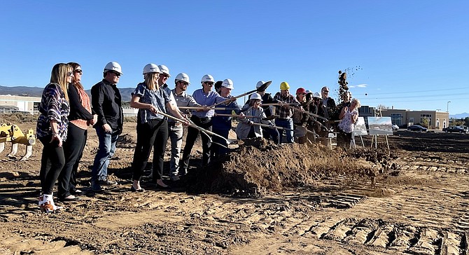 Carson City officials, Carson Medical Group staff, and representatives from Shaheen Beauchamp Builders toss dirt in the air Oct. 24 at the groundbreaking of a new medical facility slated to open in early 2024.