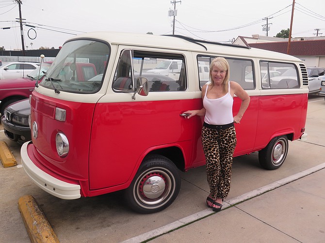 DAVE T. HENLEY / LVN
Heather Miller, who runs Newport Motorsports with her husband, Chris, is shown with a 1972 Volkswagen van under repair at their California facility.